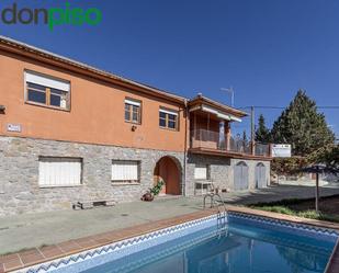 Exterior view of House or chalet for sale in Huétor de Santillán  with Private garden, Terrace and Storage room