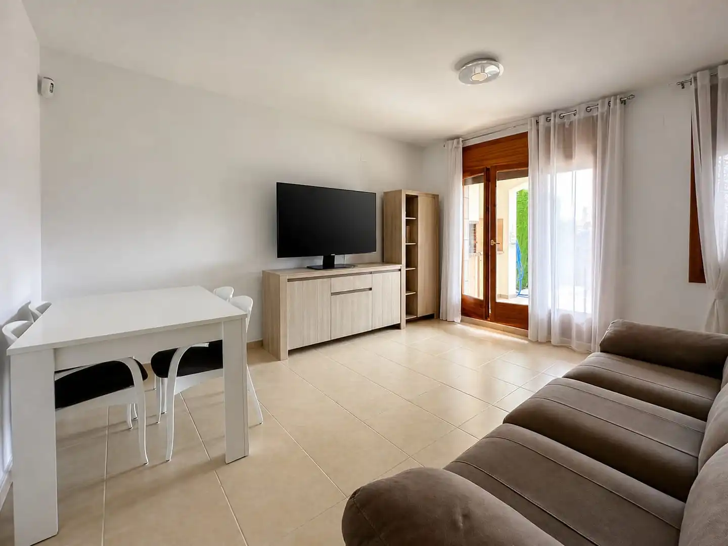 Sala de estar de Casa adosada en venta en Mont-roig del Camp con Aire acondicionado, Jardín privado y Terraza
