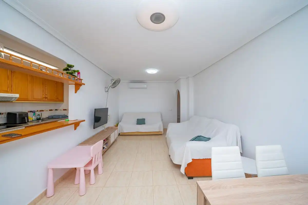 Sala d'estar de Dúplex en venda en Pilar de la Horadada amb Aire condicionat, Calefacció i Jardí privat