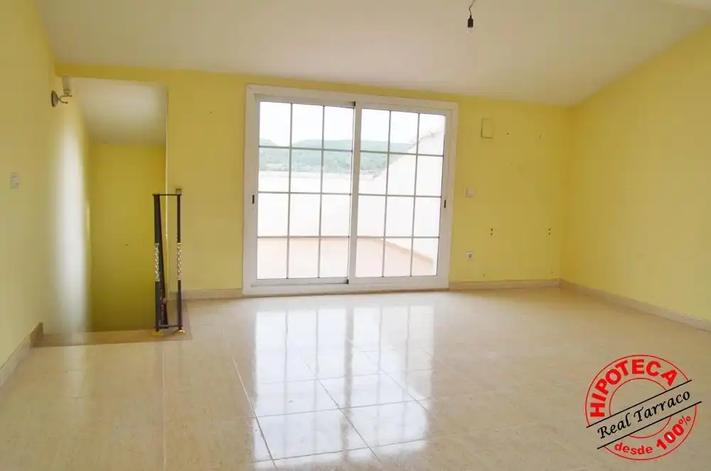 Sala de estar de Casa adosada en venta en Calafell con Piscina comunitaria