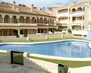 Piscina de Casa adosada de lloguer en Santa Pola amb Aire condicionat i Terrassa