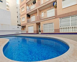 Swimming pool of Flat for sale in Torrevieja  with Air Conditioner, Heating and Terrace