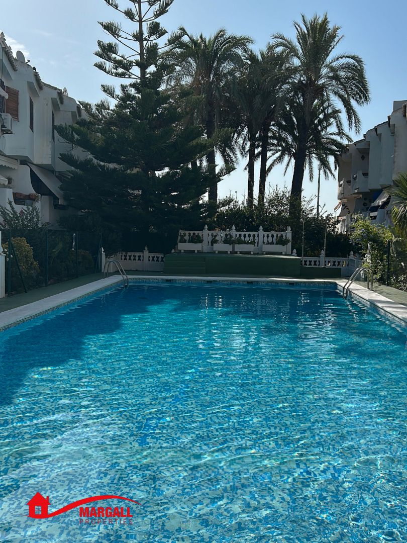Piscina de Casa adosada de lloguer en La Pobla de Farnals amb Aire condicionat, Calefacció i Terrassa