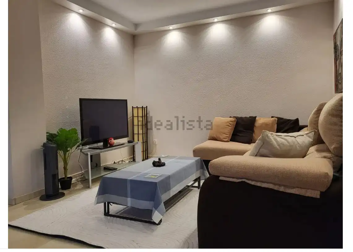 Sala d'estar de Casa adosada en venda en Villaviciosa de Odón amb Aire condicionat, Calefacció i Jardí privat