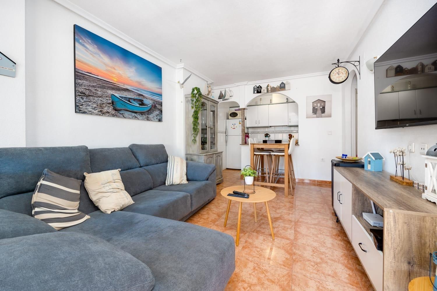 Sala d'estar de Apartament en venda en Torrevieja amb Aire condicionat, Jardí privat i Terrassa