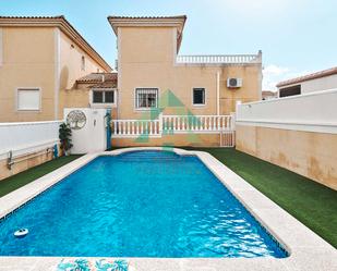 Exterior view of Single-family semi-detached for sale in Pilar de la Horadada  with Swimming Pool and Community pool