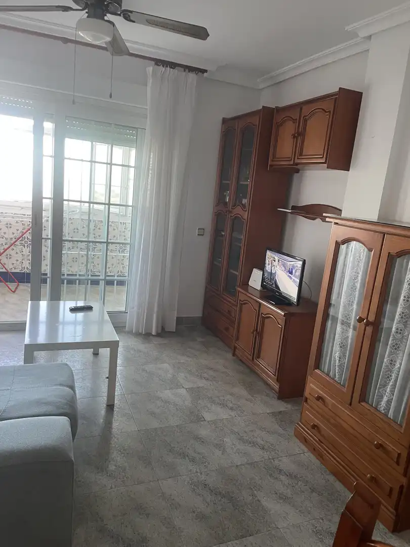 Sala d'estar de Pis per a compartir en Almería amb Aire condicionat, Terrassa i Piscina