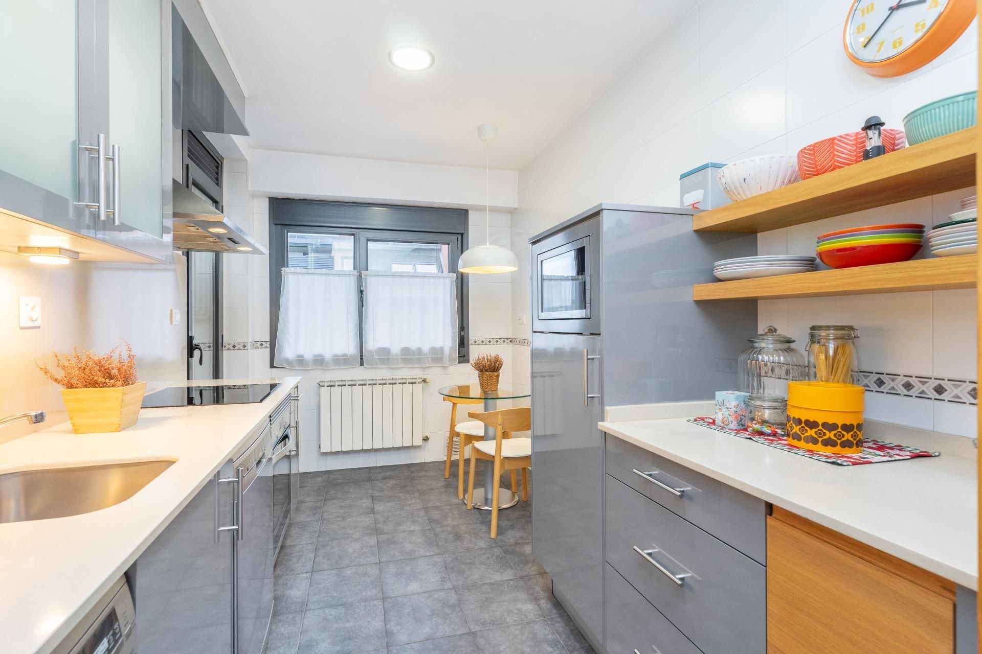 Kitchen of Flat for sale in Oviedo   with Heating, Parquet flooring and Storage room