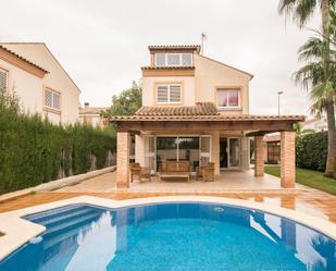 Jardí de Casa adosada de lloguer en L'Eliana amb Aire condicionat, Terrassa i Piscina