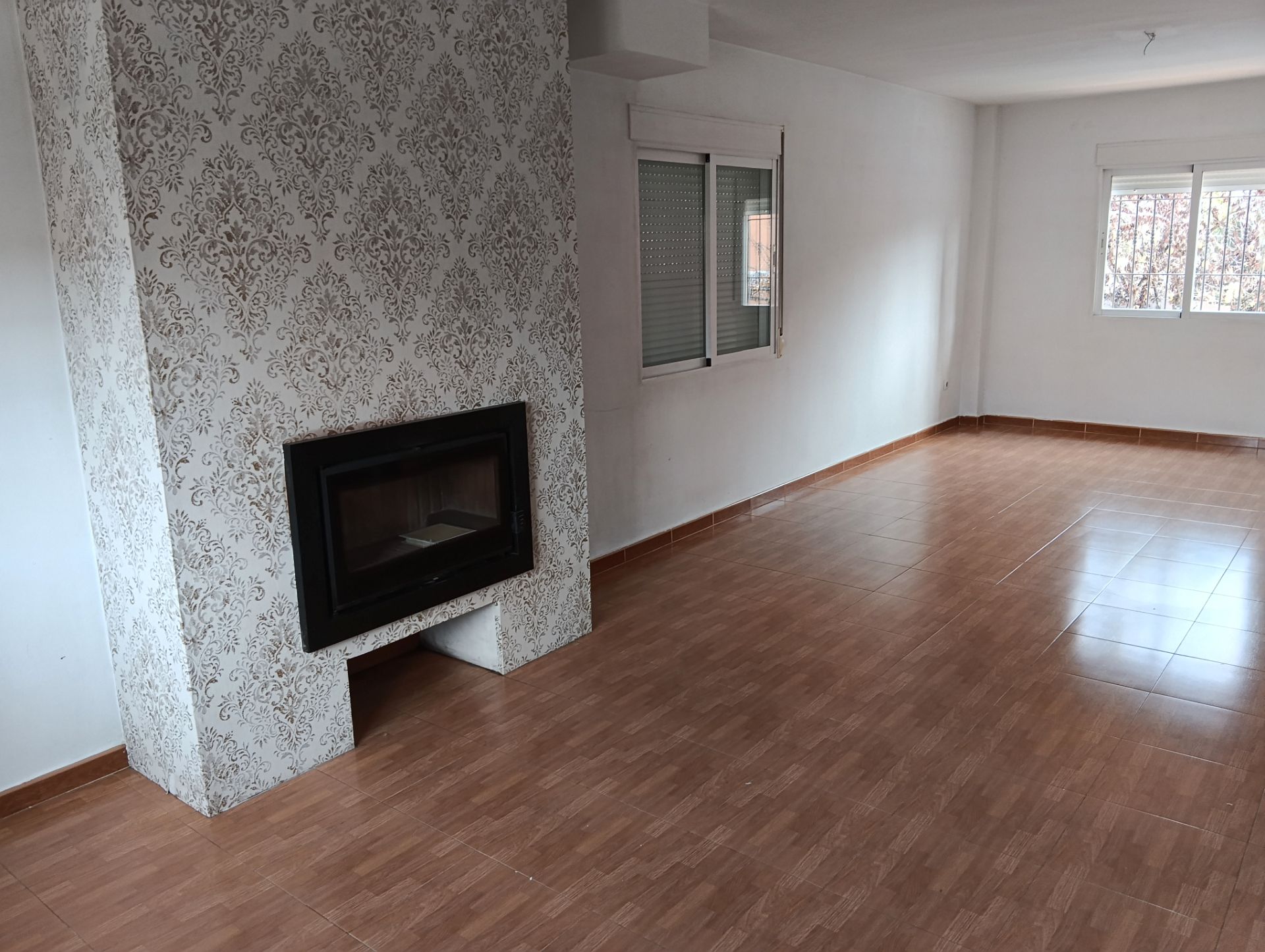 Sala d'estar de Casa adosada de lloguer en Vegas del Genil amb Terrassa, Piscina i Forn