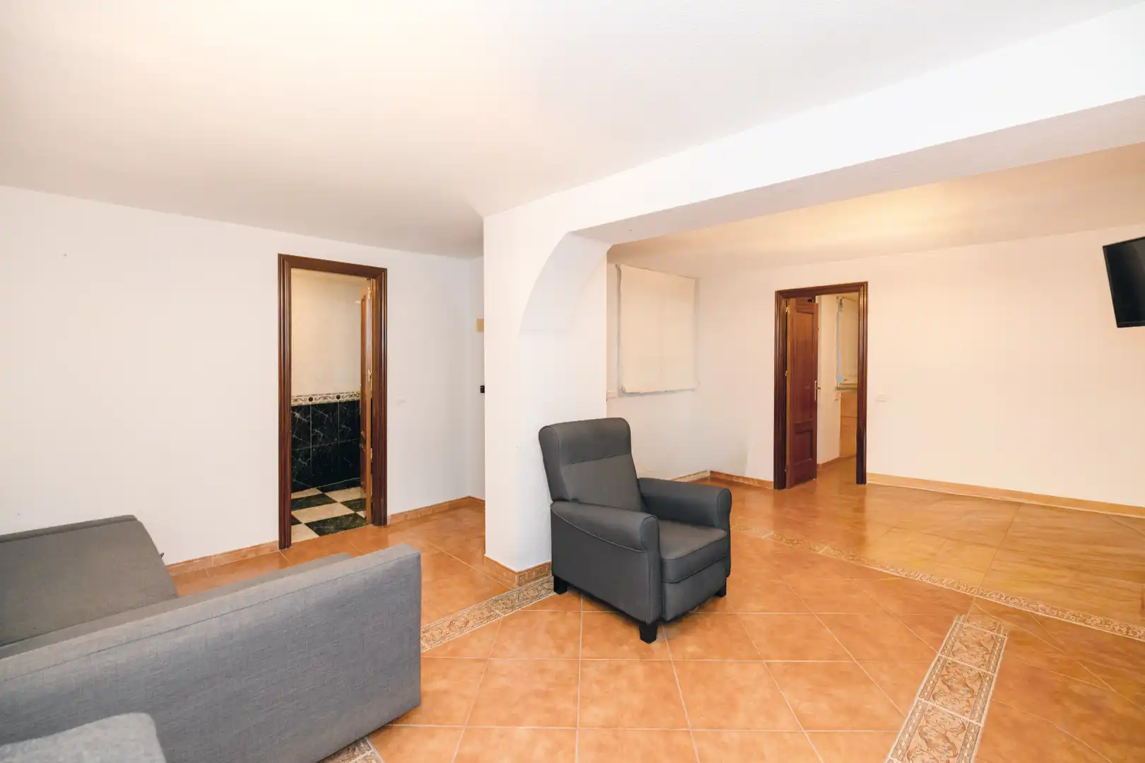Sala de estar de Casa adosada en venta en Málaga con Aire acondicionado, Calefacción y Jardín privado