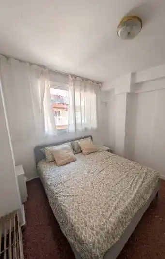 Dormitori de Apartament de lloguer en La Pobla de Farnals amb Aire condicionat, Moblat i Balcó