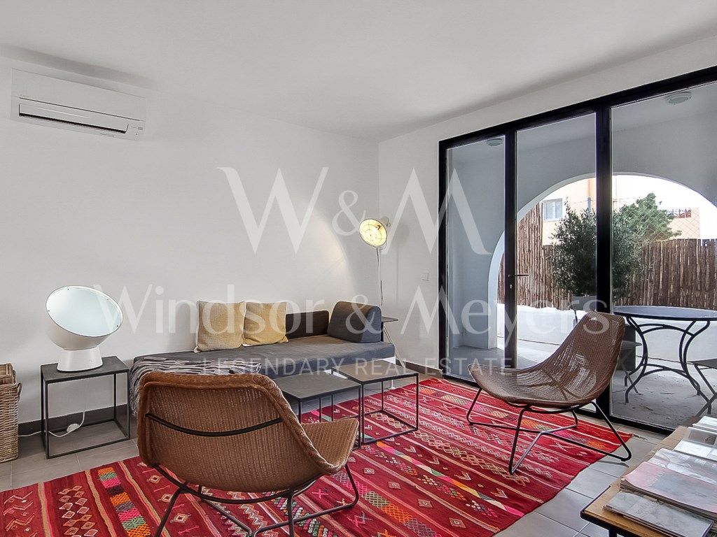 Sala d'estar de Apartament en venda en Sant Josep de sa Talaia amb Aire condicionat, Terrassa i Moblat
