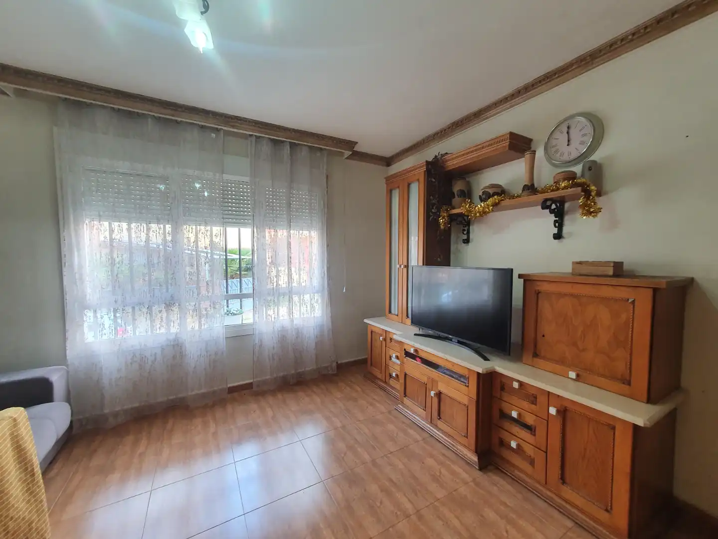 Sala d'estar de Casa adosada en venda en Guadix amb Terrassa