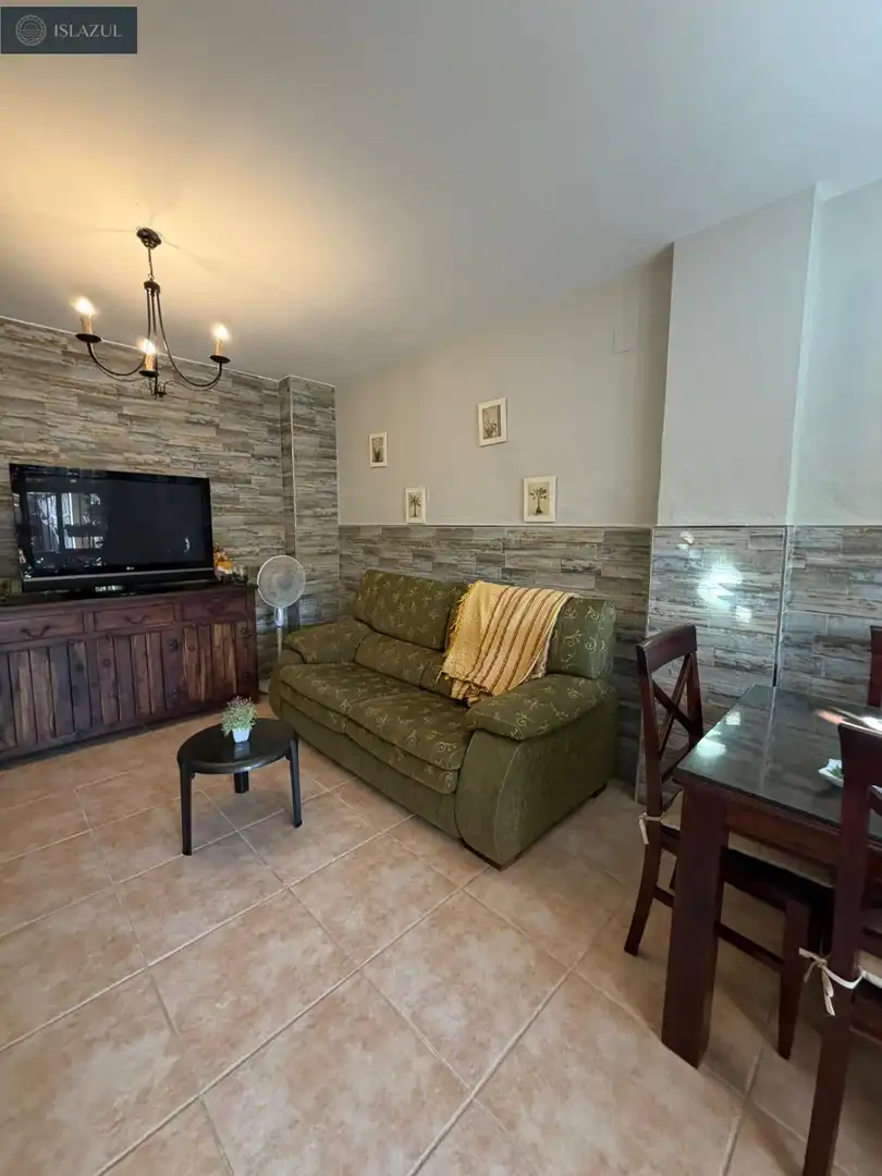 Wohnzimmer von Einfamilien-Reihenhaus zum Verkauf in Islantilla mit Privatgarten, Terrasse und Abstellraum