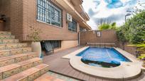 Swimming pool of Single-family semi-detached for sale in  Madrid Capital  with Air Conditioner, Heating and Private garden