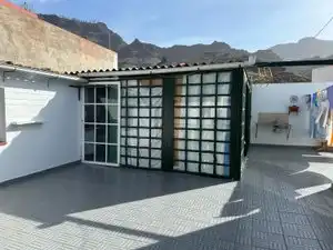 Vista exterior de Casa adosada en venda en Mogán amb Jardí privat, Piscina i Moblat