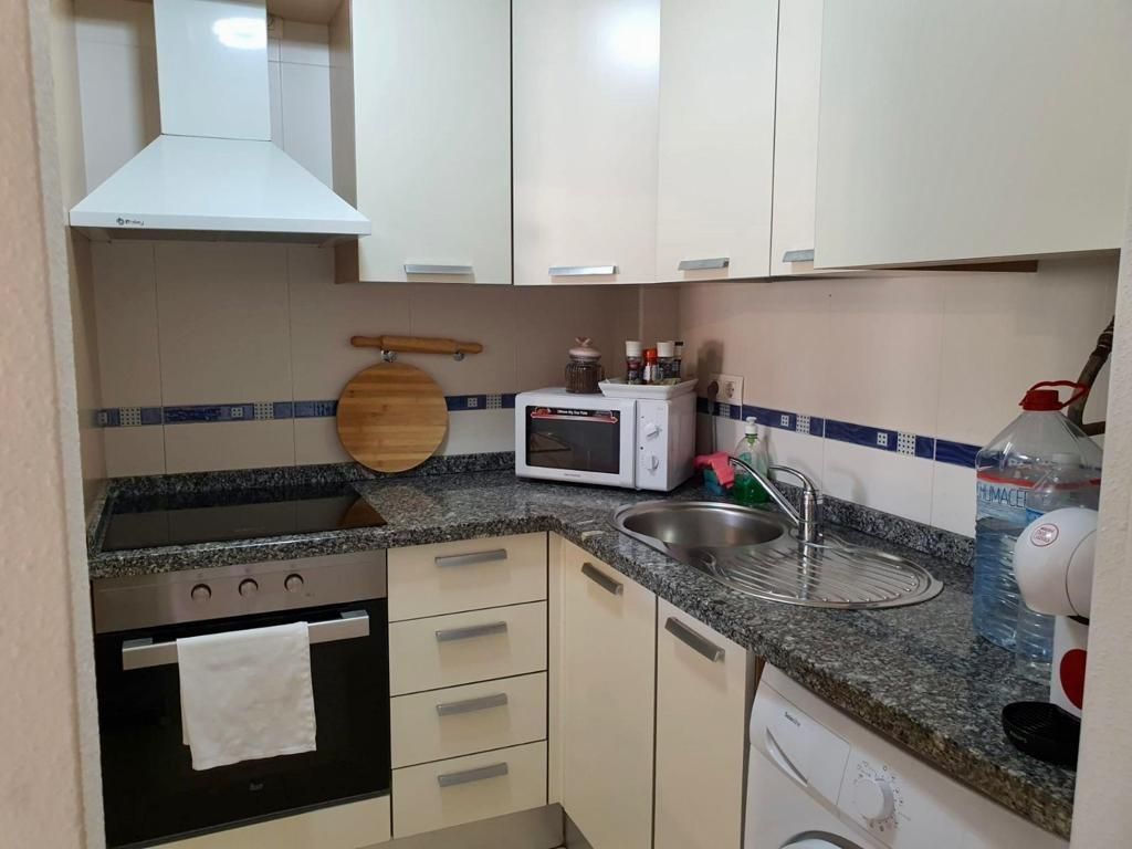 Kitchen of Flat for sale in Roquetas de Mar  with Air Conditioner, Private garden and Terrace