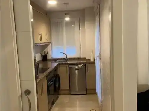 Cuina de Apartament de lloguer en Oliva amb Aire condicionat, Piscina i Moblat