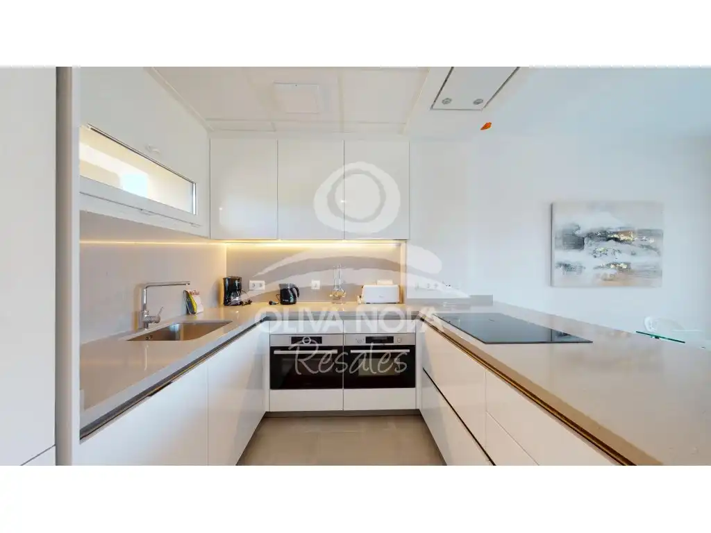 Cuina de Apartament en venda en Oliva amb Aire condicionat, Jardí privat i Terrassa