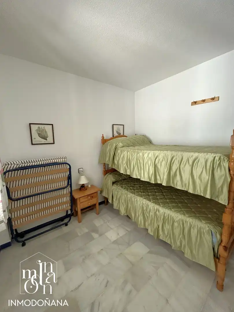 Habitación de Casa adosada en venta en Almonte con Terraza, Piscina y Amueblado