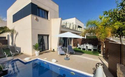 Exterior view of Single-family semi-detached for sale in Pilar de la Horadada  with Air Conditioner, Private garden and Terrace