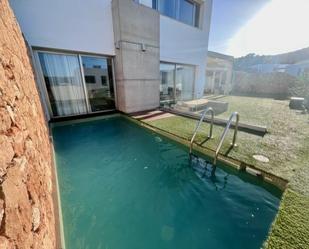 Piscina de Casa adosada en venda en Santa Eulària des Riu amb Aire condicionat, Calefacció i Jardí privat