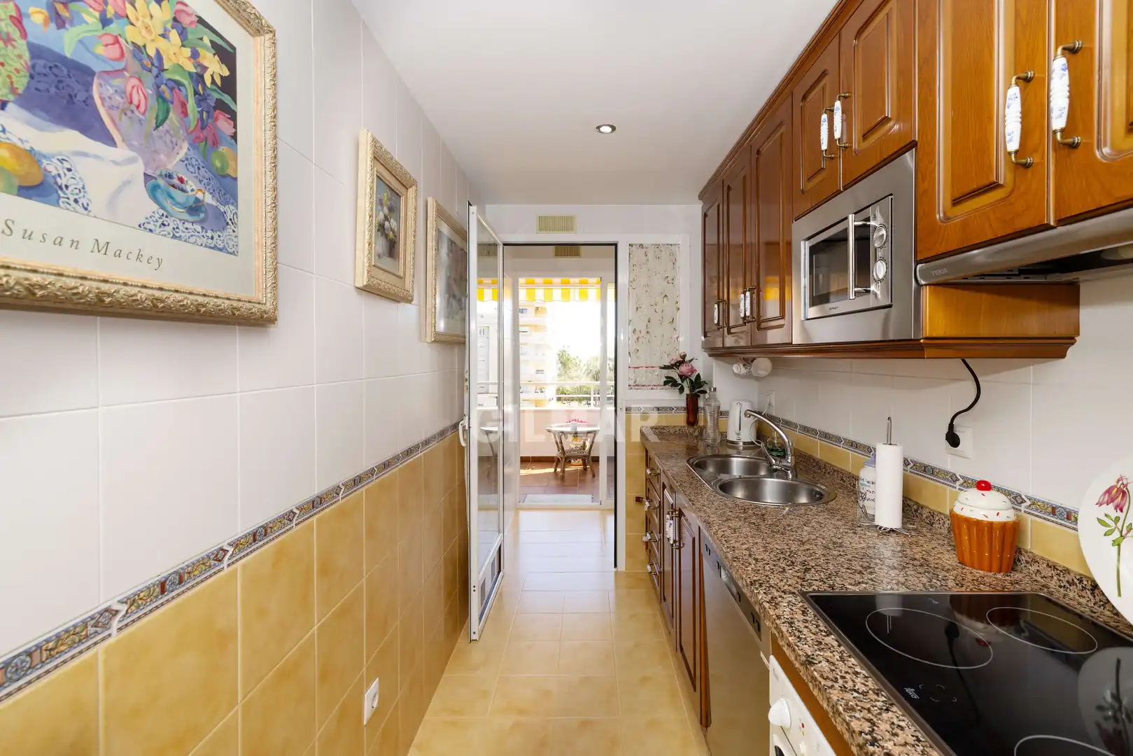 Küche von Wohnung zum Verkauf in Benalmádena mit Privatgarten, Schwimmbad und Möbliert