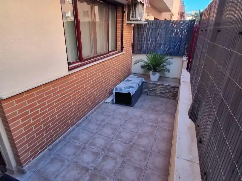 Terrassa de Casa adosada en venda en Sagunto / Sagunt amb Aire condicionat i Piscina