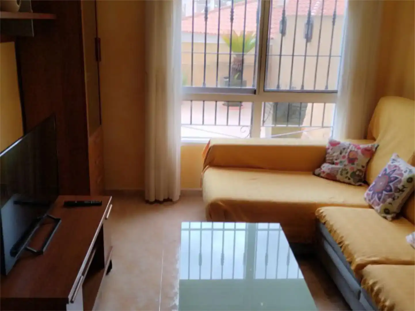Sala d'estar de Dúplex de lloguer en Águilas amb Aire condicionat, Jardí privat i Piscina