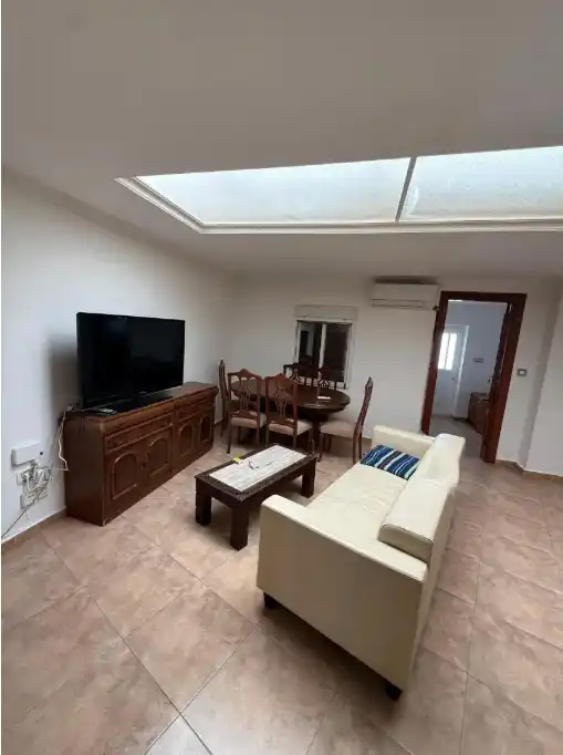 Sala de estar de Casa adosada en venta en Puertollano con Aire acondicionado, Calefacción y Amueblado
