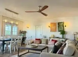 Sala d'estar de Casa o xalet en venda en Punta Umbría amb Aire condicionat, Jardí privat i Parquet