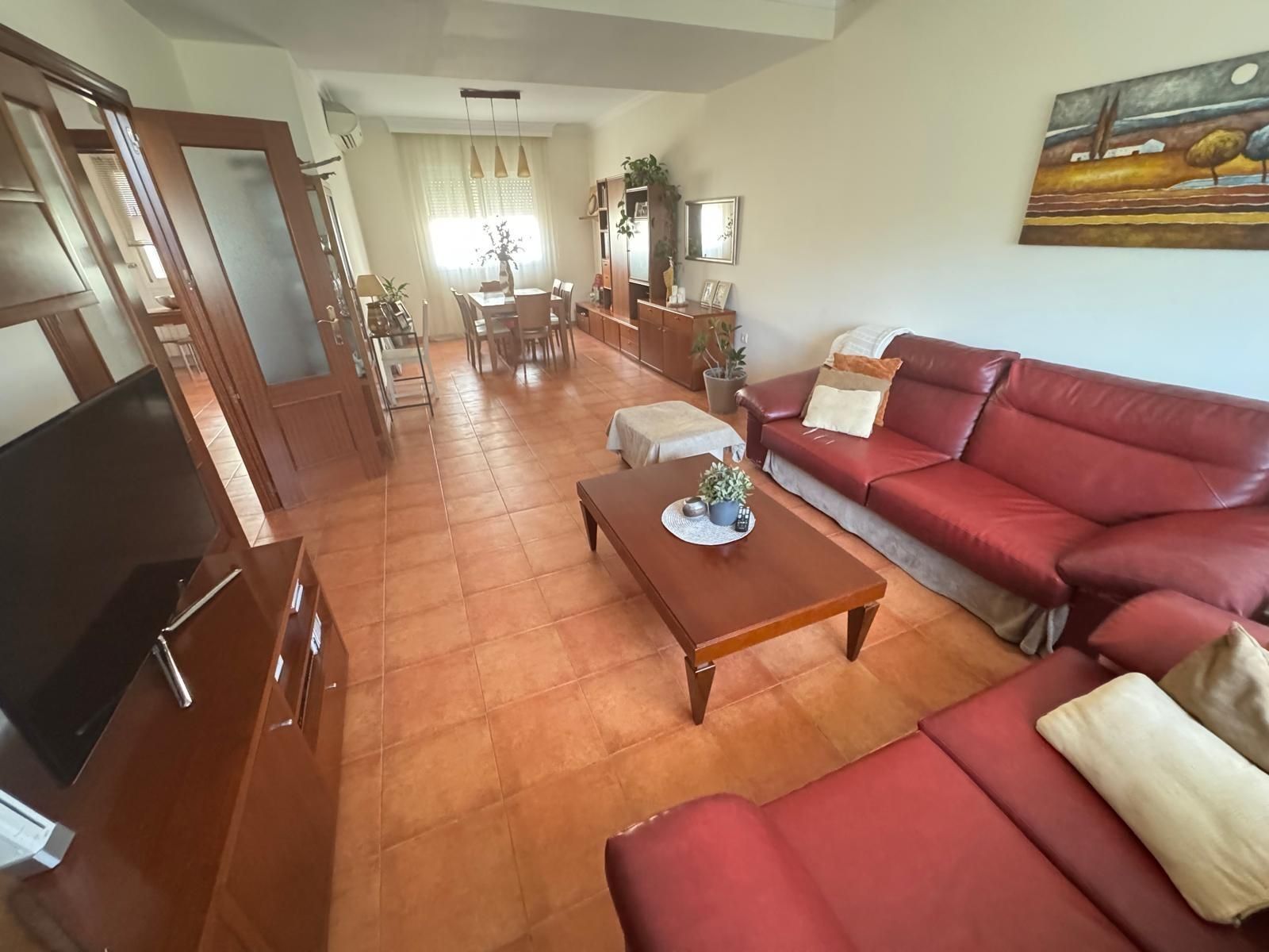 Sala de estar de Casa adosada en venta en Dos Hermanas con Aire acondicionado, Jardín privado y Terraza
