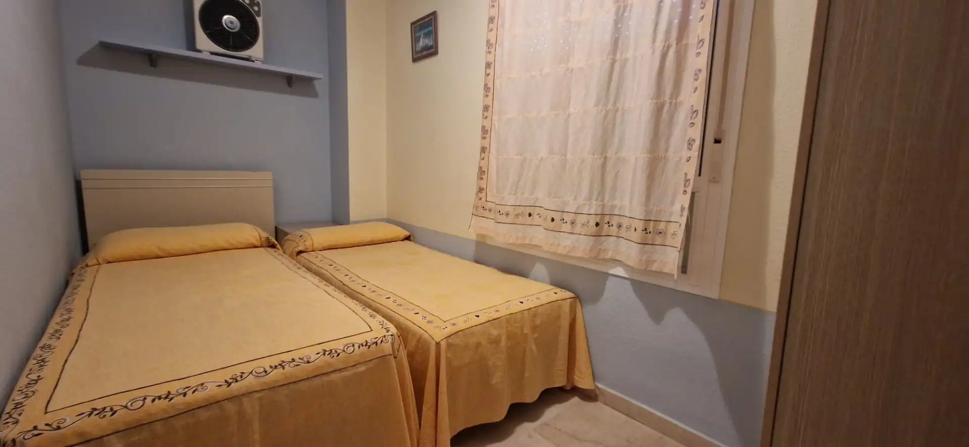 Dormitori de Apartament de lloguer en El Portil amb Piscina comunitària