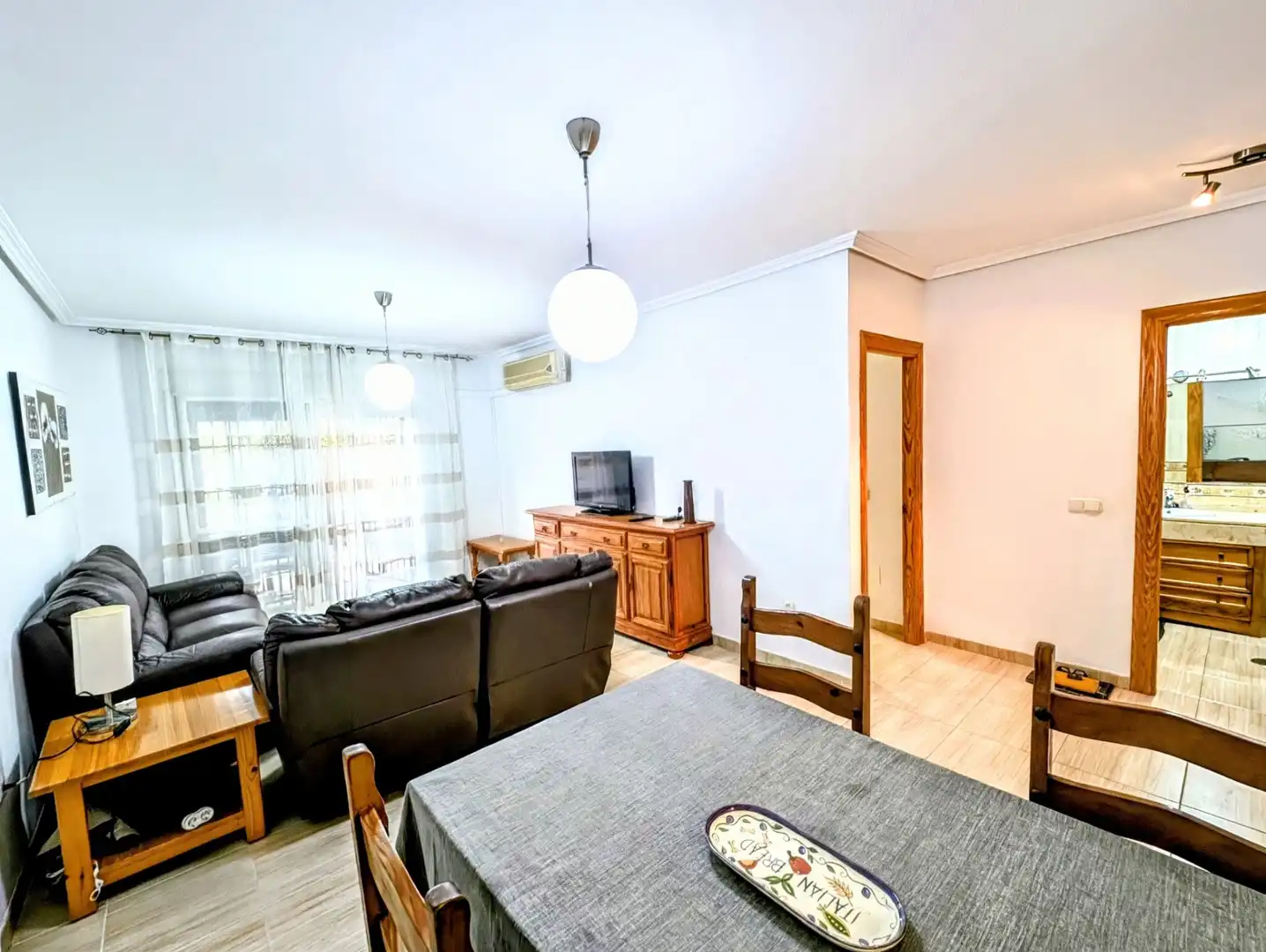 Living room of Ground floor for sale in Roquetas de Mar  with Air Conditioner, Heating and Terrace