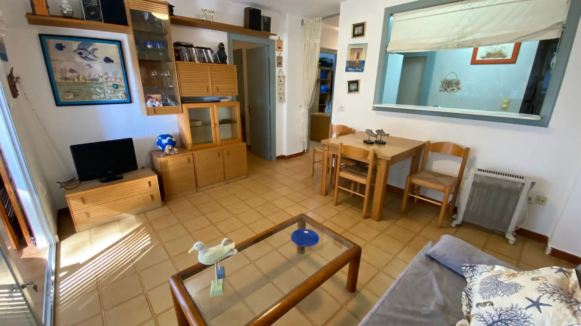 Sala d'estar de Apartament en venda en Benicasim / Benicàssim amb Jardí privat, Terrassa i Moblat