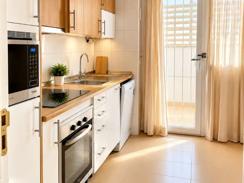 Kitchen of Flat for sale in Benalmádena  with Air Conditioner, Terrace and Swimming Pool