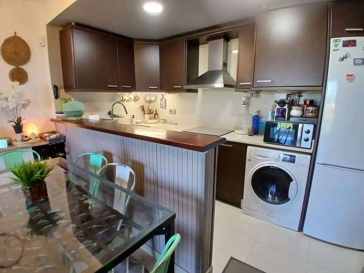 Cuina de Apartament en venda en Sant Jaume d'Enveja amb Moblat, Balcó i Piscina comunitària