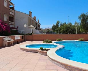 Piscina de Casa adosada en venda en Santa Pola amb Aire condicionat, Calefacció i Jardí privat