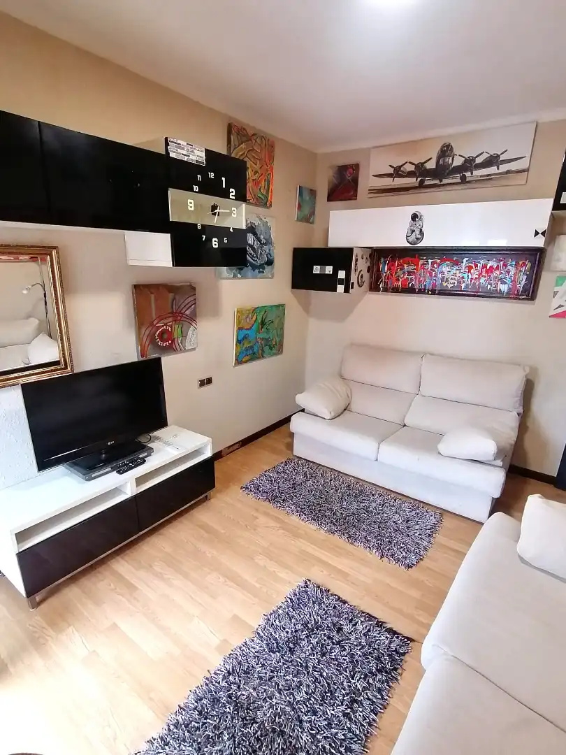 Living room of Flat for sale in Gijón   with Parquet flooring, Furnished and Oven