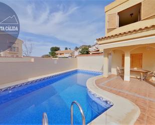 Exterior view of Single-family semi-detached for sale in Águilas  with Air Conditioner, Heating and Private garden