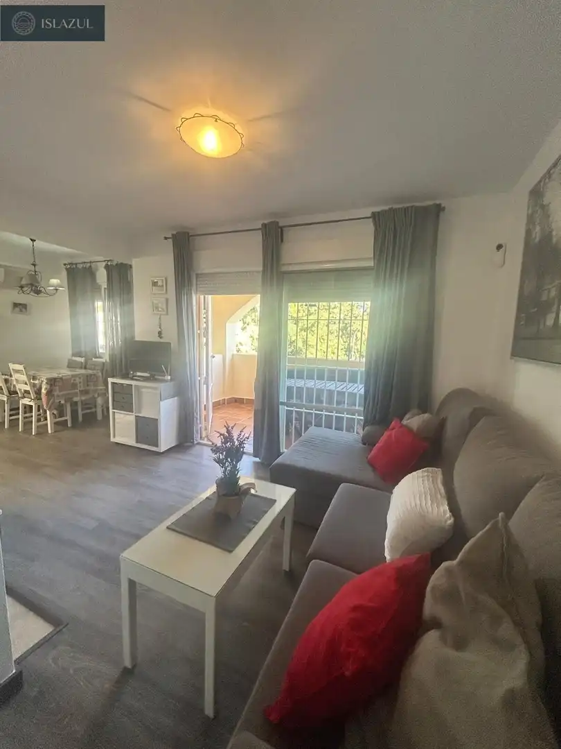Sala d'estar de Apartament en venda en Isla Cristina amb Aire condicionat, Jardí privat i Terrassa