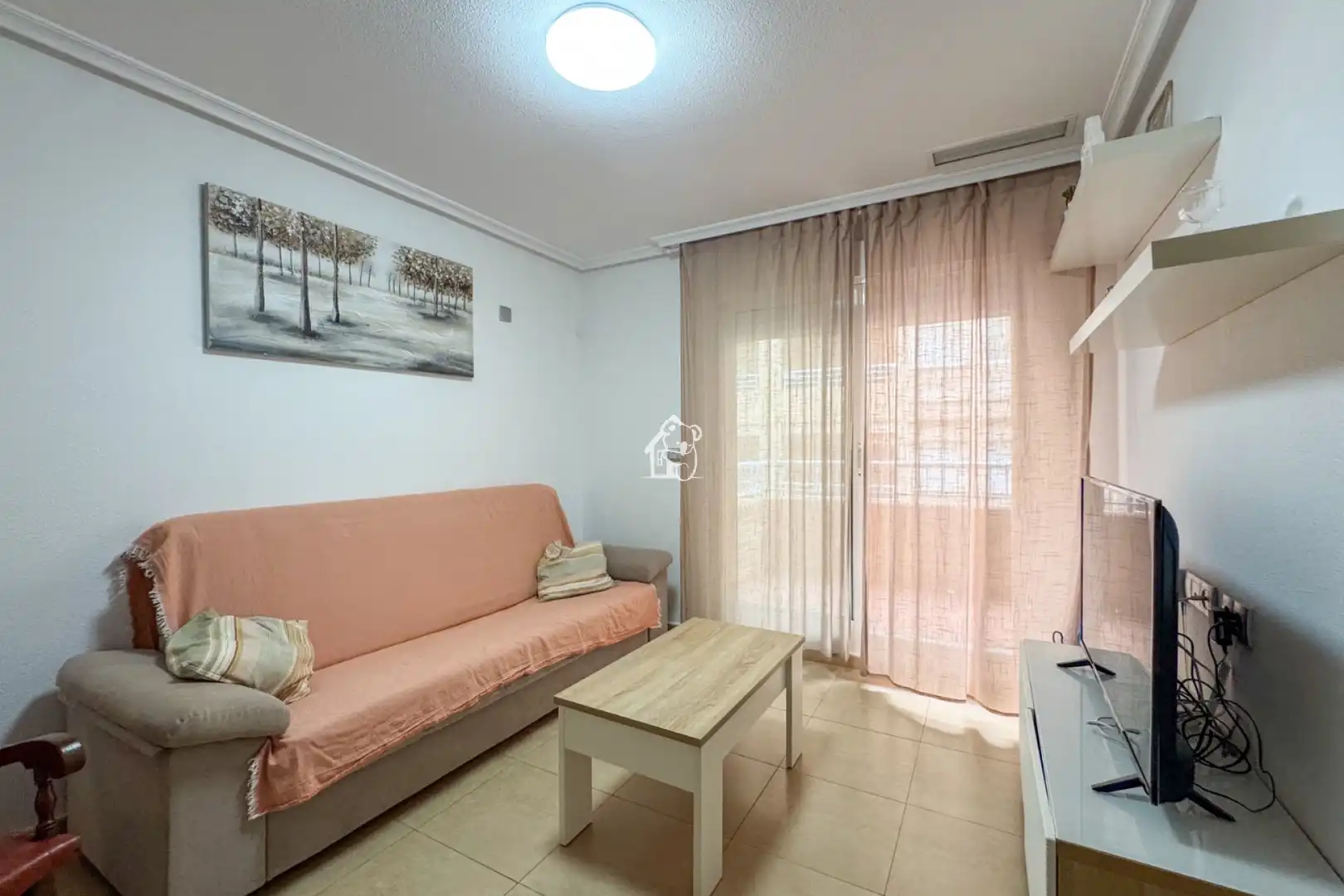 Sala d'estar de Apartament de lloguer en Torrevieja amb Aire condicionat, Terrassa i Moblat
