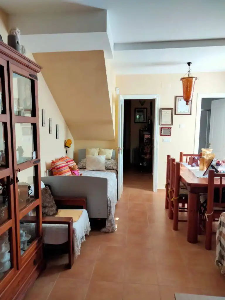 Sala de estar de Casa adosada en venta en Islantilla con Piscina comunitaria