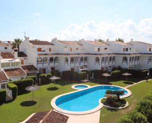 Jardí de Casa adosada de lloguer en Dénia amb Aire condicionat, Terrassa i Piscina