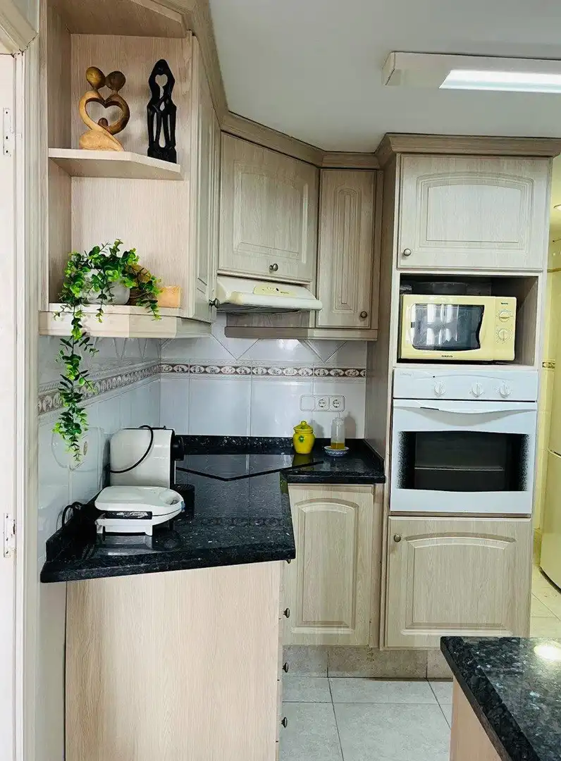 Kitchen of Flat for sale in Sueca  with Air Conditioner, Private garden and Storage room