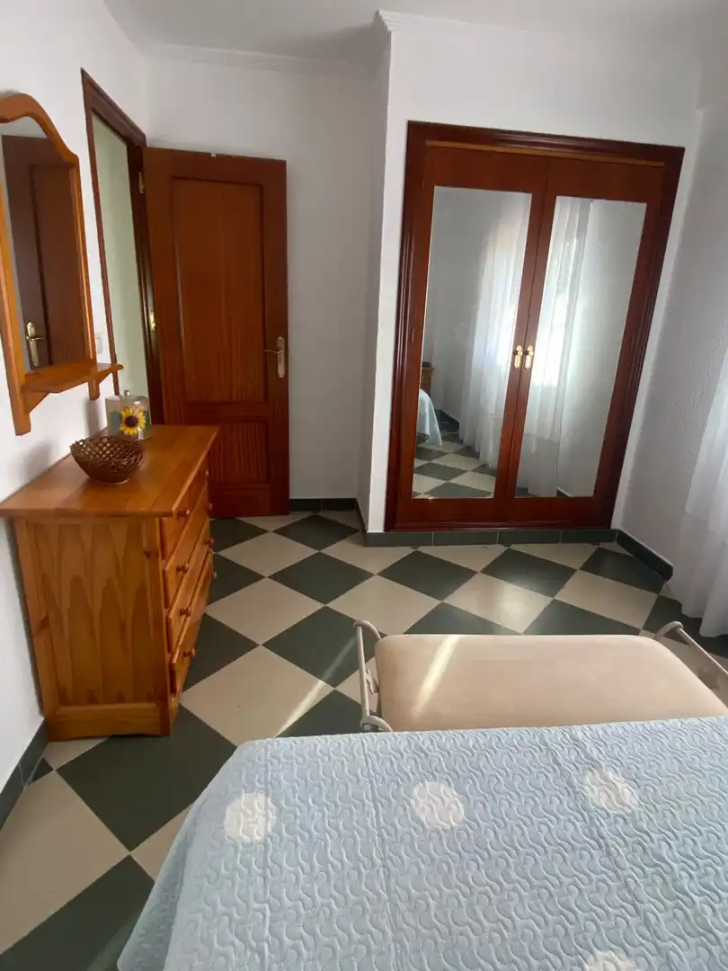 Dormitori de Pis de lloguer en Punta Umbría amb Aire condicionat, Terrassa i Moblat