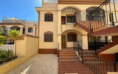 Exterior view of Single-family semi-detached for sale in Torrevieja  with Terrace, Balcony and Community pool