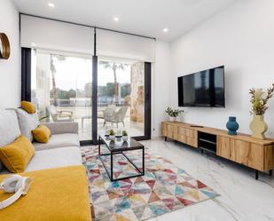 Living room of Flat for sale in Guardamar del Segura  with Air Conditioner, Private garden and Terrace