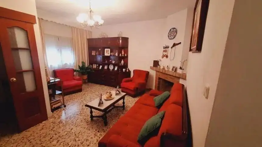 Sala de estar de Casa adosada en venta en Málaga con Aire acondicionado y Terraza